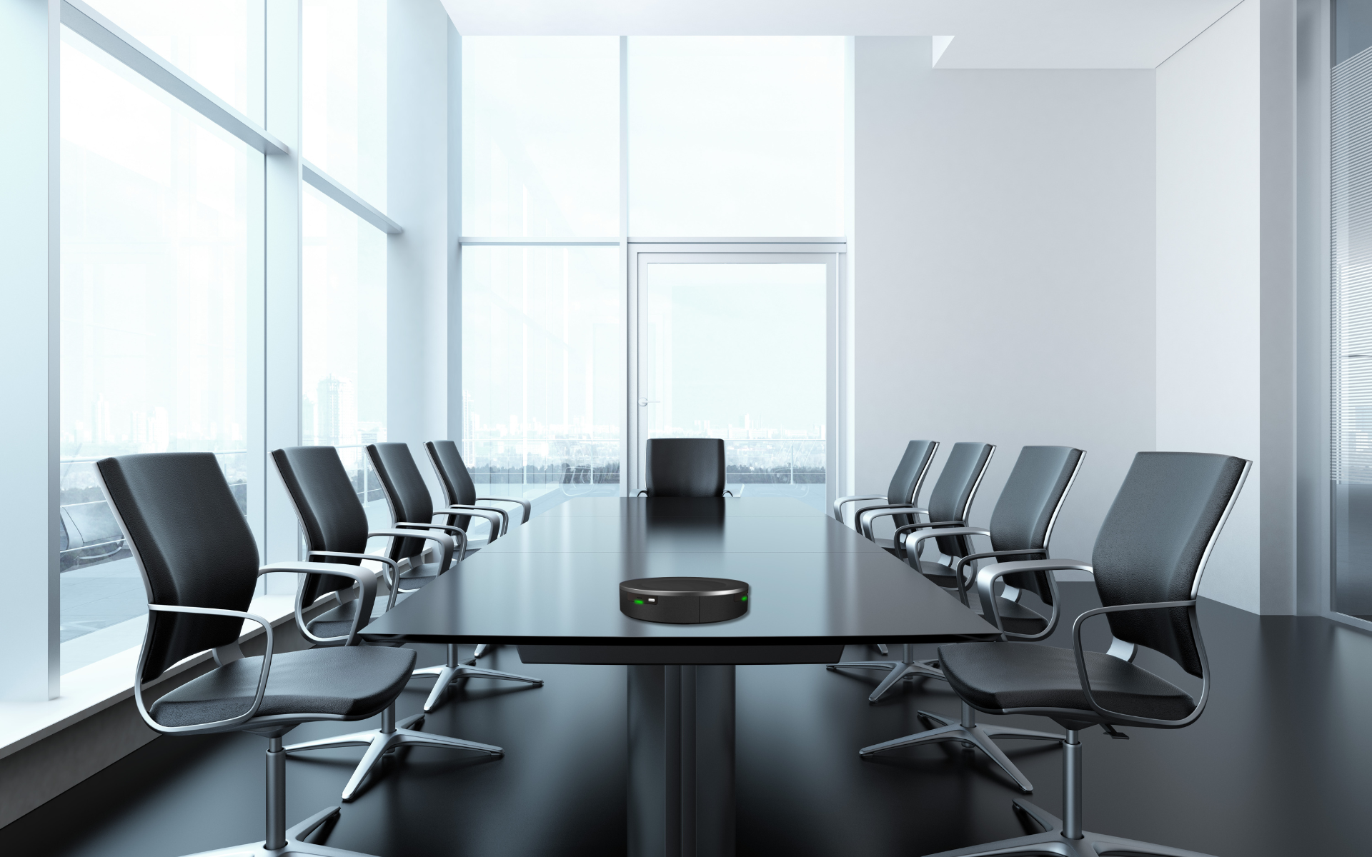 TableTalker unit centered on a modern boardroom conference table